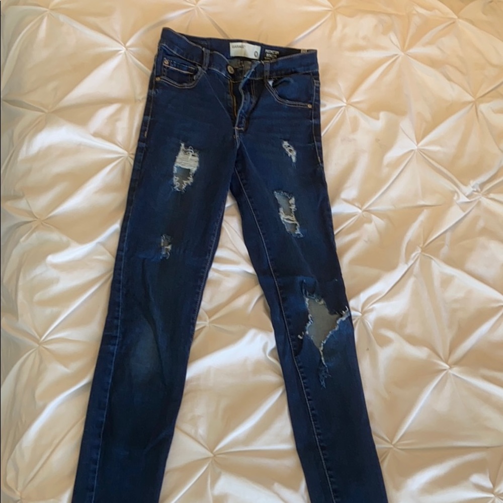 Dark blue ripped garage jeans. High waisted